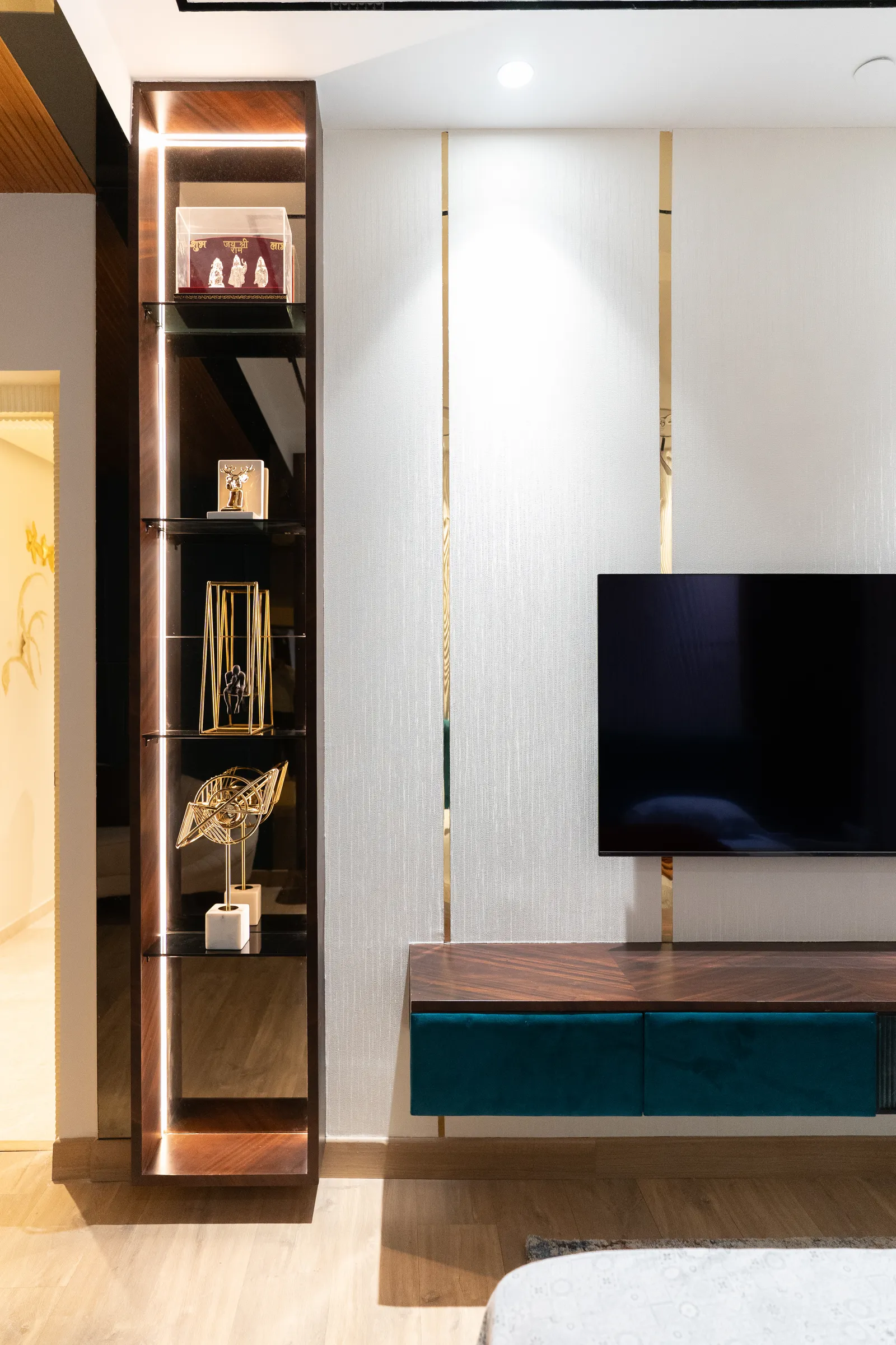 Bedroom TV unit with lit glass display shelf